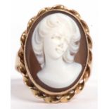 A cameo ring, the oval panel carved with a raised head and shoulders profile of a lady, bezel set in