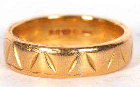 916 (22ct) hallmarked wedding ring with a chased geometric design, 7.8 gms, size N/O