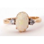 18ct gold opal and diamond ring, the cabochon oval cut opal multiclaw set between two small old