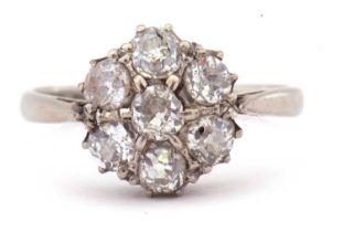 Diamond cluster ring, a flower head design featuring seven old cut diamonds, ct weight app 0.65,