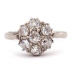 Diamond cluster ring, a flower head design featuring seven old cut diamonds, ct weight app 0.65,