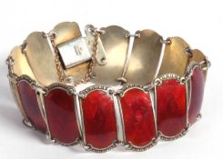 Ivar Holth Norwegian enameled bracelet with fourteen crimson red starburst enamel panels, 16cm long,