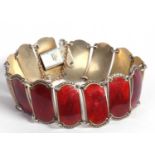 Ivar Holth Norwegian enameled bracelet with fourteen crimson red starburst enamel panels, 16cm long,