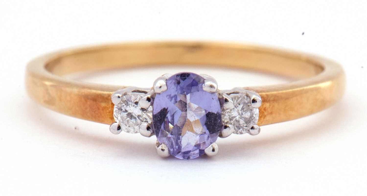 Tanzanite and diamond three stone ring, the oval cut tanzanite is 5x4mm raised between two small - Image 2 of 7