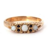 9ct gold opal and sapphire ring featuring three small graduated round cut opals highlighted