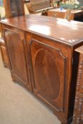 Georgian mahogany two door linen press cabinet with inlaid decoration raised on ogee feet, 122 cm