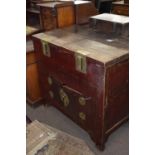 Unusual Chinese elm and brass bound cabinet, the top with two lifting hinged lids over two covered