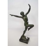 Green patternated figure of a Art Deco dancer, on onyx base, the figure stamped Reto, 45cm high