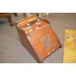 Victorian oak coal box of wedge form with brass handle and carved decoration