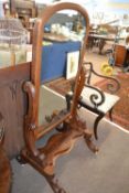 Victorian mahogany framed cheval mirror with scrolled side supports and outswept legs, 147cm high