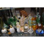 Quantity of perfume bottles and atomisers together with two glass table lighters one with matching