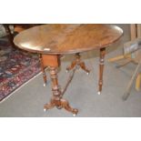 Victorian walnut veneered circular drop leaf Sutherland style table raised on turned supports with