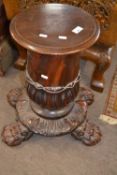 Unusual 19th Century and later small mahogany pedestal table or plant stand, raised on four paw