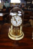 400 day brass clock under glass dome