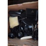 Box containing quantity of ebonised wooden stands, brushes and other items