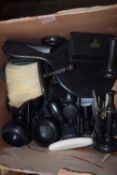 Box containing quantity of ebonised wooden stands, brushes and other items