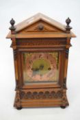 Late 19th Century carved wooden mantel clock with gilt brass dial, 45cm high