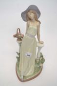 Large Lladro figure of a young girl leaning against a veranda surrounded with flowers on heart