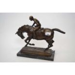 Spelter model of a racehorse and jockey on rectangular onyx base, 30cm long