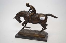 Spelter model of a racehorse and jockey on rectangular onyx base, 30cm long