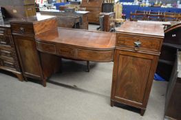 Georgian mahogany twin pedestal drop centre sideboard with four drawers and two panelled doors