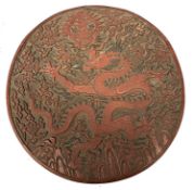 Large Chinese laquer circular box decorated with Chinese symbols and a large sinuous dragon, 25cm