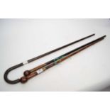 Mixed lot of two sword sticks, one stamped Cpt.W.Kirk, 2.D.G and further walking stick with silver