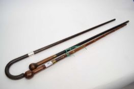 Mixed lot of two sword sticks, one stamped Cpt.W.Kirk, 2.D.G and further walking stick with silver