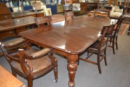 Late Victorian mahogany extending dining table together with a composite set of six leather