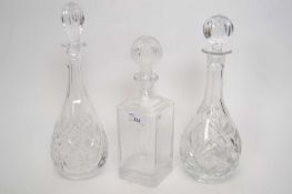Group of three cut glass decanters