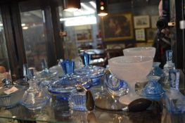 Quantity of blue glass items, dressing table sets, jars and covers, small vase, perfume atomiser