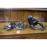 Pair of contemporary bronzed resin figures of male and female nude, indistinctly signed, 22cm high