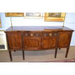Large Georgian revival mahogany serpentine front side board with brass railed back raised on