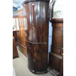 Georgian mahogany floor standing bow front four door corner cabinet with shelved interior, 199cm