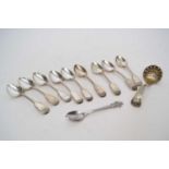 Small plastic box containing quantity of silver plated teaspoons and strainer spoon