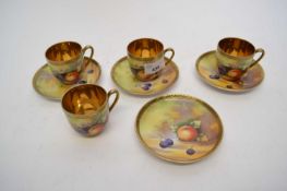 Group of four Japanese porcelain fruit painted cups and saucers, some signed by K Asai