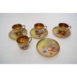 Group of four Japanese porcelain fruit painted cups and saucers, some signed by K Asai