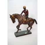 Large Spelter model of a racehorse with jockey up on rectangular base, 50cm long