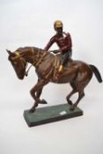 Large Spelter model of a racehorse with jockey up on rectangular base, 50cm long