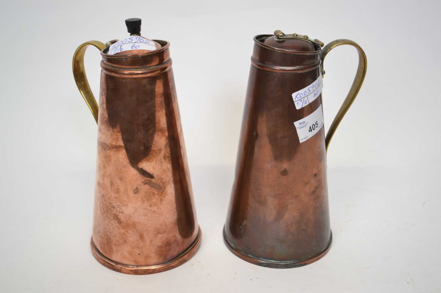 Two copper jugs, one stamped W A S Benson, 23cm high