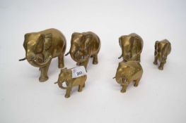 Graduated set of six brass elephants, tallest 14cm high