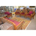 20th Century Far Eastern hardwood lounge suite comprising three seater sofa and four chairs all