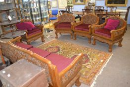 20th Century Far Eastern hardwood lounge suite comprising three seater sofa and four chairs all