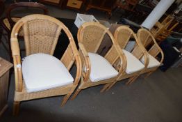 A SET OF FOUR CANE CONSERVATORY ARMCHAIRS