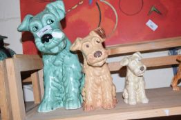 THREE VARIOUS SIZED SYLVAC DOGS