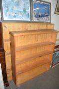TWO PINE BOOKCASES, THE LARGER WITH APPROX 150CM