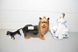 TWO CERAMIC DOG MODELS AND A ROYAL DOULTON FIGURE