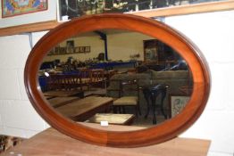 MAHOGANY FRAMED OVAL OVER MANTEL MIRROR, LENGTH APPROX 106CM