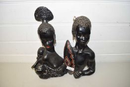 PAIR OF WALL SCULPTURES OF AN AFRICAN LADY AND MAN