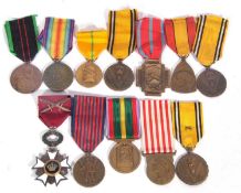 A quantity of 11 WWI/II Belgian medals to include 3 x 1940-45 war medals (one with crossed
